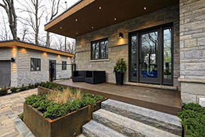 Decking featuring TimberTech PRO Legacy Collection Mocha with two outdoor chairs