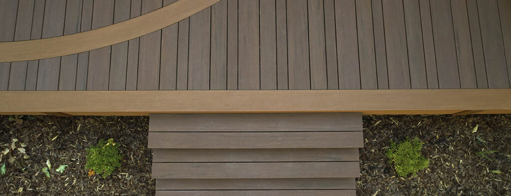 Picture frame composite deck featuring TimberTech AZEK Vintage Collection in Mahogony Cypress Multi width