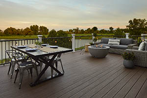 Deck Featuring TimberTech PRO Reserve Collection in Dark Roast with dining and living area