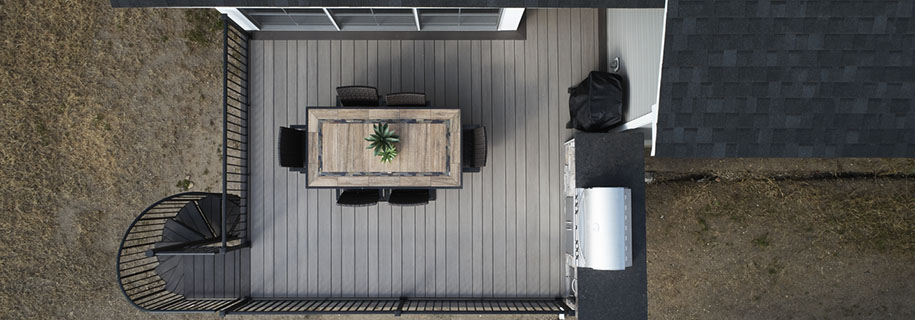 Custom-built spiral stairs on a composite deck