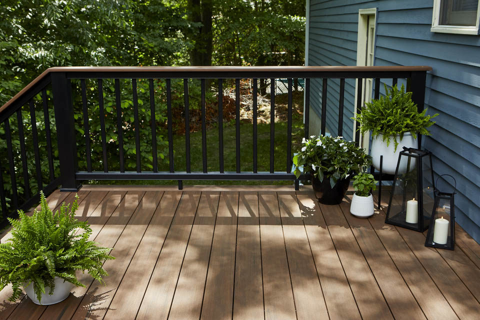 Black composite railing suits a woodland deck