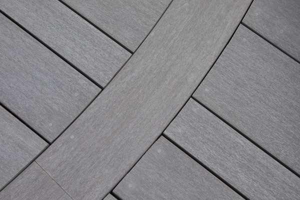 Close up of Dark Hickory decking installed with AZEK Cortex screws