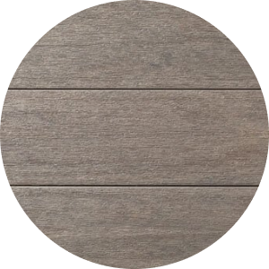 A close up of Coastline decking, medium gray decking with warm tan and charcoal undertones. This color is from our Advanced PVC Porch Collection. 