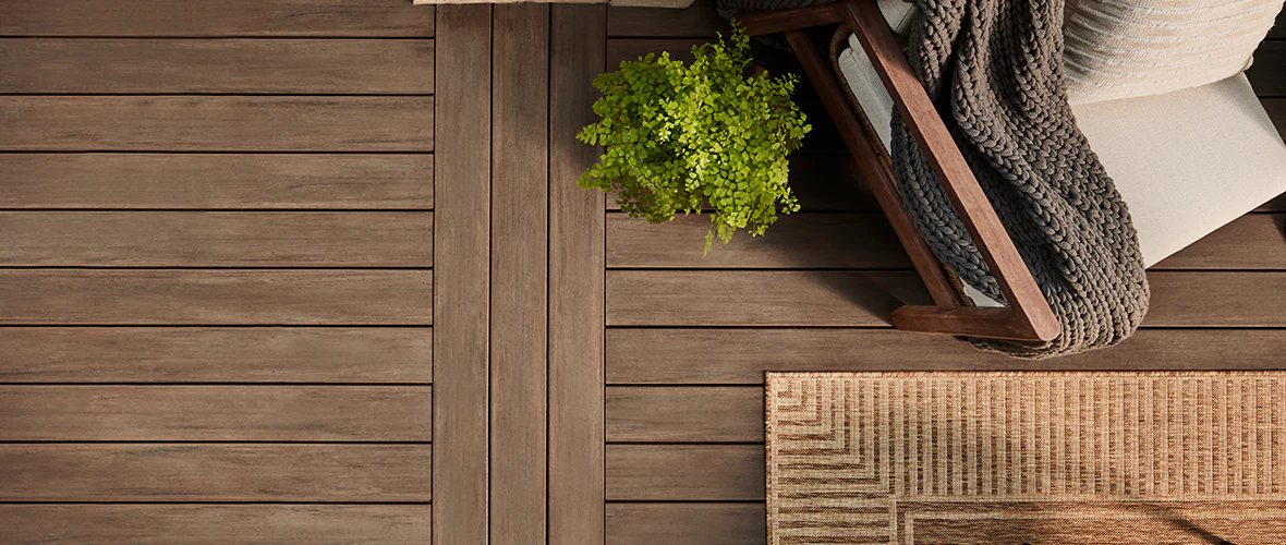 An example of a PVC deck in a rich brown color with complementary outdoor furniture.