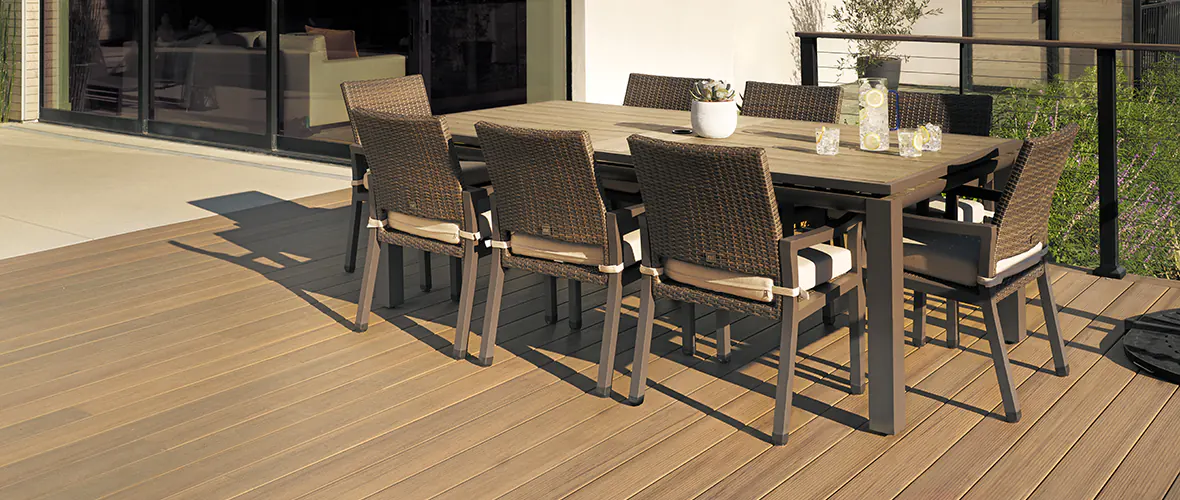 A finished deck correctly installed with an outdoor dining area added as a finishing touch.