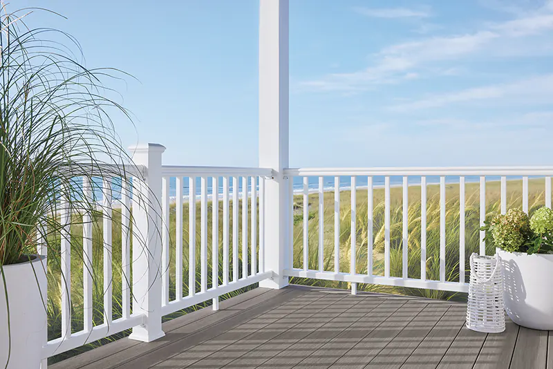 Opting for light-colored deck boards and white railing will match environment of many coastal homes.