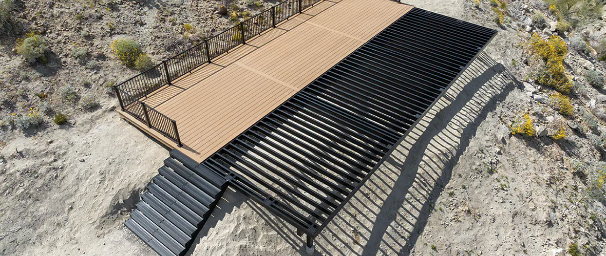 Aerial shot of a TimberTech deck being built atop an aluminum substructure in the desert.