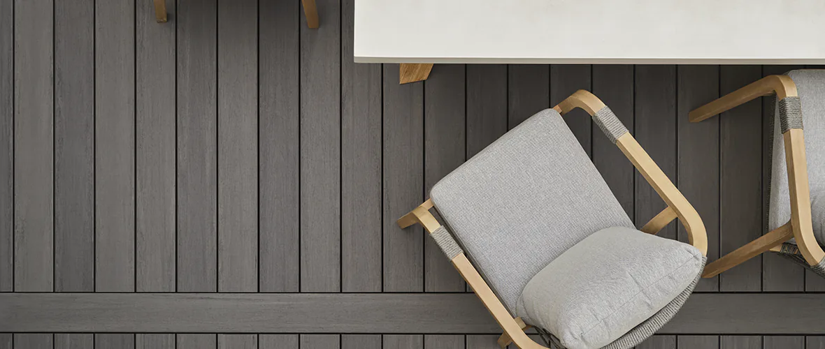 A table and chairs on a deck.