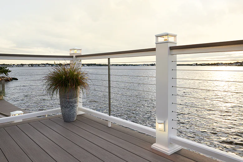 Light gray deck with extra wide deck boards near the water