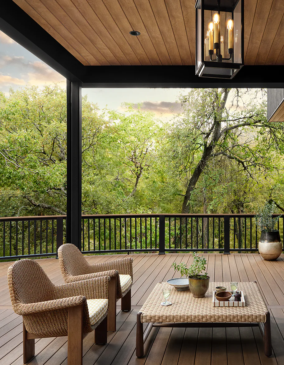 The ceiling of the first story deck is visible with hanging lanterns prominently positioned to light the deck at night